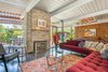 Modern home with Living Room, Sectional, Chair, Rug Floor, Coffee Tables, Gas Burning Fireplace, and Porcelain Tile Floor. The living room lets the outdoors in. Furniture by Room and Board Photo 5 of Sunnyvale Eichler Remodel