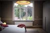 Modern home with Bedroom, Wardrobe, Light Hardwood Floor, Carpet Floor, Bed, Accent Lighting, and Ceiling Lighting. The master bedroom Photo 10 of Maison de Maitre - Brussels