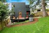 The slope of the Monolith's backyard gives it a bit of a treehouse effect. Photo 4 of The Monolith modern home