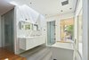 Modern home with Engineered Quartz Counter, Undermount Sink, and Ceiling Lighting. Master Bath Photo 13 of The TORO House