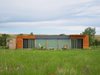 Modern home with Exterior, House Building Type, Metal Roof Material, Metal Siding Material, and Wood Siding Material. Front Elevation Photo 15 of Little Box on the Prairie