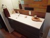 Modern home with Bath Room, Engineered Quartz Counter, Recessed Lighting, Wall Lighting, Medium Hardwood Floor, Wall Mount Sink, Open Shower, Mosaic Tile Wall, and One Piece Toilet. Bathroom Photo 4 of Little Box on the Prairie