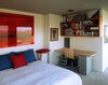 Modern home with Bedroom, Bed, Chair, Night Stands, Shelves, Storage, Bookcase, Ceiling Lighting, Recessed Lighting, Table Lighting, and Carpet Floor. Bedroom Photo 6 of Little Box on the Prairie