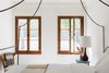 Modern home with Bedroom, Chair, Bed, Night Stands, Table Lighting, and Medium Hardwood Floor. Guest Bedroom Photo 7 of Dundee Residence