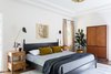 Modern home with Bedroom, Night Stands, Bed, Medium Hardwood Floor, Wall Lighting, and Ceiling Lighting. Master bedroom Photo 12 of Dundee Residence