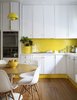 Modern home with Kitchen, White Cabinet, Pendant Lighting, and Ceramic Tile Backsplashe. This sunny yellow kitchen successfully mixes vintage charm with mid-century furniture. Photo of 40+ Yellow Modern Home Design Ideas