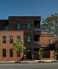 Modern home with Front Yard, Side Yard, Horizontal Fences, Wall, Wood Fences, Wall, Swing Door Type, Exterior, Casement Window Type, Glass Railing, Metal Railing, and Hallway. Heat-treated ash rain screen cladding Photo 5 of Taphouse