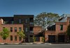 Modern home with Side Yard, Front Yard, Trees, Wood Fences, Wall, Exterior, Swing Door Type, Detached Garage Room Type, Vertical Fences, Wall, Casement Window Type, Staircase, Glass Railing, and Metal Railing. Tap House, Canton, Baltimore MD Photo 4 of Taphouse