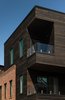 Modern home with Sliding Door Type, Swing Door Type, Exterior, Casement Window Type, Staircase, and Glass Railing. Cantilevered glass balconies overlook the courtyard below while providing waterfront view. Photo 8 of Taphouse