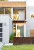 Modern home with Outdoor, Garden, Raised Planters, Stone Patio, Porch, Deck, Front Yard, Grass, Hardscapes, Gardens, Metal Patio, Porch, Deck, Horizontal Fences, Wall, Landscape Lighting, Concrete Patio, Porch, Deck, Pavers Patio, Porch, Deck, Walkways, Small Patio, Porch, Deck, Field, Decking Patio, Porch, Deck, Metal Fences, Wall, Retaining Fences, Wall, and Large Patio, Porch, Deck. East Elevation Entry Detail Photo 5 of Spa Creek House