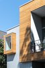 Modern home with Exterior, Glass Siding Material, Green Roof Material, Metal Roof Material, Flat RoofLine, Wood Siding Material, House Building Type, Metal Siding Material, and Stucco Siding Material. West Elevation Detail Photo 6 of Spa Creek House