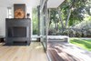 Modern home with Living Room, Concrete Floor, Recessed Lighting, Ceiling Lighting, Bench, Standard Layout Fireplace, Light Hardwood Floor, and Wood Burning Fireplace. Living Room Photo 9 of Spa Creek House