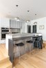 Modern home with Ceiling Lighting, Light Hardwood Floor, and Recessed Lighting. Kitchen w/ Custom Steel Bar Top Photo 14 of Spa Creek House