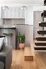 Modern home with Ceiling Lighting, Light Hardwood Floor, and Recessed Lighting. Kitchen + Stair Detail Photo 16 of Spa Creek House