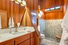 Master bath: Roman tub and rain shower. Clerestory windows around the vaulted ceilings Photo 10 of Abalone Bay modern home