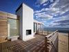 Upper deck with fireplace Photo 7 of House On The Point modern home