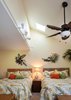Modern home with Bedroom, Track Lighting, Carpet Floor, Night Stands, Pendant Lighting, Table Lighting, Ceiling Lighting, and Lamps. Skylight over beds Photo of Waterside Lane 2nd Story Addition over 2 car garage
