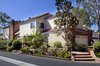 Modern home with Exterior, Hipped RoofLine, House Building Type, Tile Roof Material, and Wood Siding Material. 2nd Story Addition over two car garage Photo 6 of Waterside Lane 2nd Story Addition over 2 car garage