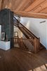 Staying respectful to the original design style, we opened an atrium leading up to the second (main) floor, adding a grander dimension to the space Photo 5 of The Tree House modern home
