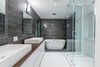 We added two master bedrooms, bathrooms a cabana bath and updated the materials throughout, all without disturbing the lush surroundings. Photo 8 of The Tree House modern home