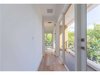 Second floor corridor leading to the second bedroom. Photo 14 of Tigertail II modern home