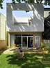 Modern home with Outdoor, Trees, Small Patio, Porch, Deck, Back Yard, Wood Patio, Porch, Deck, Wood Fences, Wall, and Horizontal Fences, Wall. Rear addition and backyard Photo of Cerda House