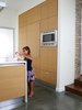 Modern home with Kitchen, Engineered Quartz Counter, Concrete Floor, Wood Cabinet, Refrigerator, and Microwave. View of kitchen Photo 4 of Cerda House