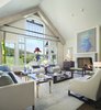 Modern home with Living Room, Wood Burning Fireplace, Coffee Tables, Bench, and Ceiling Lighting. The sitting room Photo of Clubside Residence
