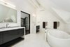 Modern home with Bath Room, Stone Tile Wall, Marble Counter, Drop In Sink, and Freestanding Tub. Master Bathroom Photo 14 of Historic Hallam