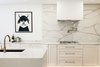 Modern home with Kitchen, Engineered Quartz Counter, White Cabinet, Medium Hardwood Floor, Light Hardwood Floor, Stone Slab Backsplashe, Ceiling Lighting, Floor Lighting, Recessed Lighting, Accent Lighting, Cooktops, and Undermount Sink. K I T C H E N
Photo 8 of Brentwood