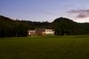 Modern home with Exterior, House Building Type, Wood Siding Material, Flat RoofLine, and Concrete Siding Material. View from the road Photo 7 of Caney Fork Cabin