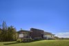 Modern home with Exterior, House Building Type, Wood Siding Material, Concrete Siding Material, and Flat RoofLine. View of the front entrance with screen porch Photo 3 of Caney Fork Cabin