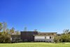 Modern home with Exterior, House Building Type, Wood Siding Material, Concrete Siding Material, and Flat RoofLine. View of the Front entrance Photo 2 of Caney Fork Cabin