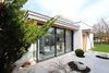 Modern home with Outdoor, Boulders, Small Patio, Porch, Deck, and Front Yard. The existing courtyard was transformed into the living room Photo 12 of Extension of a house in Geneva
