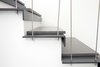 Modern home with Staircase, Metal Railing, Metal Tread, Cable Railing, and Stone Tread. Existing wooden stair transformed into a steel/cement plate stair Photo 7 of Extension of a house in Geneva