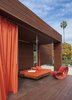 Modern home with Outdoor, Large Patio, Porch, Deck, Back Yard, Hanging Lighting, Wood Fences, Wall, Wood Patio, Porch, Deck, Trees, and Horizontal Fences, Wall. An outdoor swing bed makes the most of sunny, Santa Monica weather. Photo 3 of Dawnsknoll