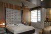 The bedrooms include the high headboard, a dresser decorated using the ancient technique of Silver Leaf and handles specially sourced from jewelers in Jaipur with the combination of Malakite, Pearls and Jade. Photo 2 of Mind, Perception and Personality space modern home