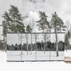 Modern home with Exterior, Cabin Building Type, Prefab Building Type, Metal Roof Material, Glass Siding Material, and Flat RoofLine. Just outside Estonia is the ÖÖD Hotel, a prefabricated, mirrored house that can be plunked down as a guest stay. Designed to blend in to its surroundings, ÖÖD is ideal for both natural and urban spaces. Glass is attached to the steel structure, spanning three sides of the house, while the back wall consists of heat-treated wood. Natural ash wood makes up the contemporary interiors and comes equipped with a queen size bed, ergonomic kitchen area, and bathroom Photo of ÖÖD hotel in Estonia Jõeranna Residences