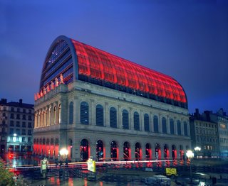 Nouvel won a competition that let to him renovating the original opera house. Melding both the past and present, his project increased interior space, added an underground practice hall, and doubled the building's height with a steel-and-glass vault.