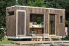 Modern home with Wood Siding Material, Green Roof Material, House Building Type, and Exterior. The Sturgis sits on a custom galvanized steel foundation with removable wheels and hitch, so it can be easily transported to site and then dropped directly on the ground, removing the need for a crane or big crew. The modular aluminum and garapa deck can be expanded or reconfigured with just two people. Photo 4 of The Sturgis