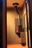 Modern home with Living Room, Wood Burning Fireplace, Track Lighting, and Ceiling Lighting. The Dwarf wood-burning stove by Utah's Tiny Wood Stoves won't overheat the small space. Because the solid cross-laminated-timber walls have the same structural strength throughout, the custom steel stand and wood box can hang directly off the wall. Photo 2 of The Adirondack