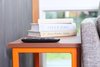 Modern home with Living Room, Sofa, End Tables, and Coffee Tables. Matching custom end tables of enameled steel with ipe waterfall tops bookend the Article loveseat. The tables can also turn on their side and join together to form a coffee table. Photo 4 of The Adirondack