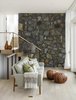 Modern home with Living Room, Sofa, Ottomans, Recessed Lighting, and Light Hardwood Floor. The exterior field stone wraps into the interior here, further blurring the line between indoors and out. Photo 3 of The Lighthouse