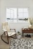 Modern home with Living Room, Chair, End Tables, and Light Hardwood Floor. Natural textures and materials used throughout in a neutral palette. Photo 9 of The Lighthouse