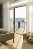 Modern home with Living Room, Sofa, Ottomans, and Light Hardwood Floor. The view from the living/dining room. Photo 12 of The Lighthouse