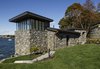 Modern home with Outdoor, Shrubs, Side Yard, Slope, Grass, Trees, and Walkways. The approach from the main house. Photo 10 of The Lighthouse
