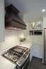 Custom copper hood detail Photo 12 of Washington Highlands Home Renovation modern home