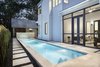 A compact lap pool tucked on the south side of the house is bounded by both the master bedroom and central screen porch.
www.clarkrichardson.com Photo 3 of Central Austin Residence modern home