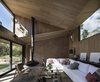 Modern home with Living Room, Hanging Fireplace, Concrete Floor, Coffee Tables, Chair, Sectional, and Wall Lighting. The interiors boast a chic, contemporary feel.
Photo 6 of L house