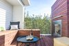 Modern home with Outdoor, Rooftop, Trees, Small Patio, Porch, Deck, Decking Patio, Porch, Deck, Metal Fences, Wall, and Wood Patio, Porch, Deck. 3rd Floor Balcony/Penthouse-A seating nook was designed to orient the observer towards the lighthouse and the evening sunset. The siding on both the chimney and the stair tower were detail with mitered/woven corners to give them a clean, unencumbered contemporary look Photo 2 of The Live Oak House